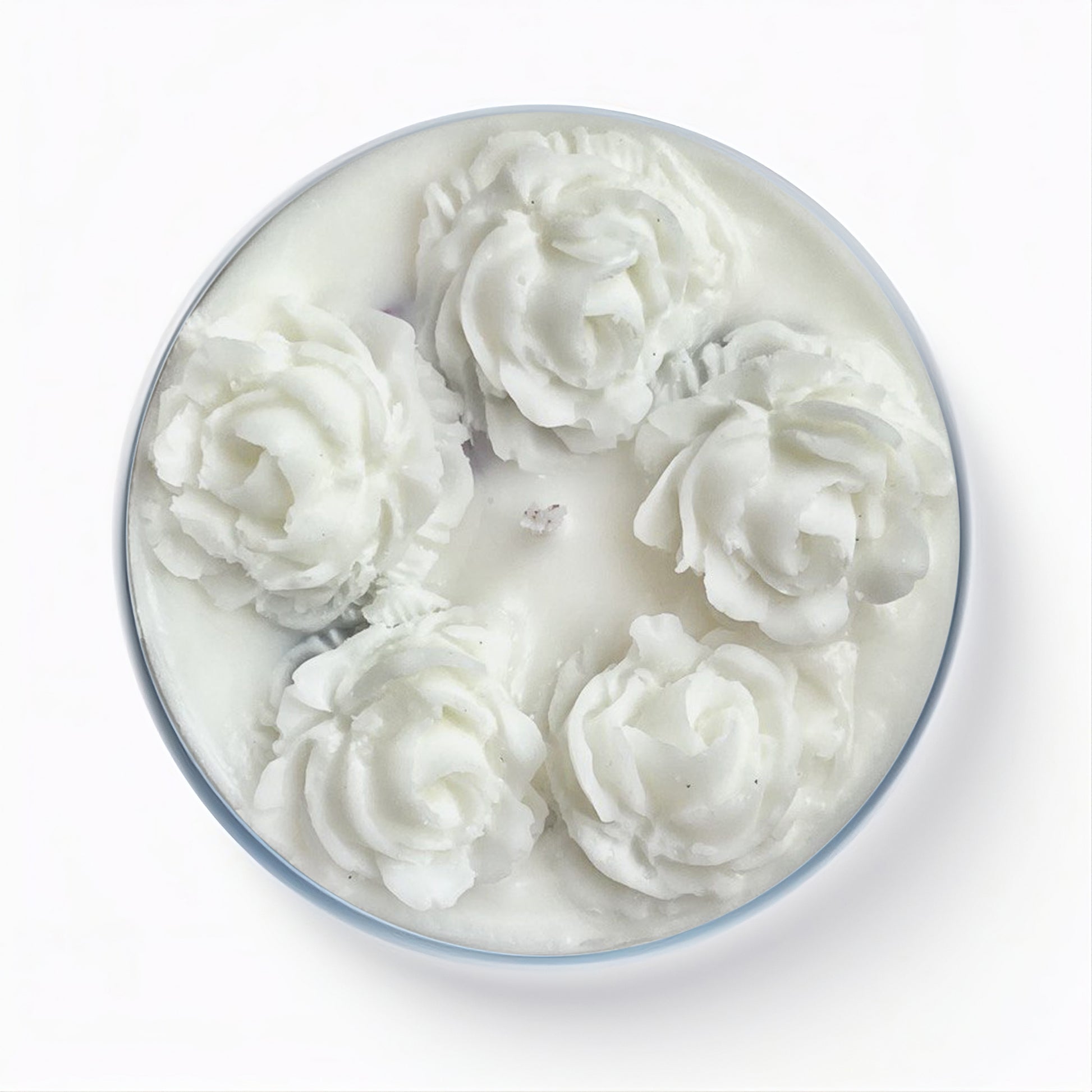 Top view of large soy wax candle in glass jar - Mystic Rose with wax roses on the top. Brand: Happahee Candles.