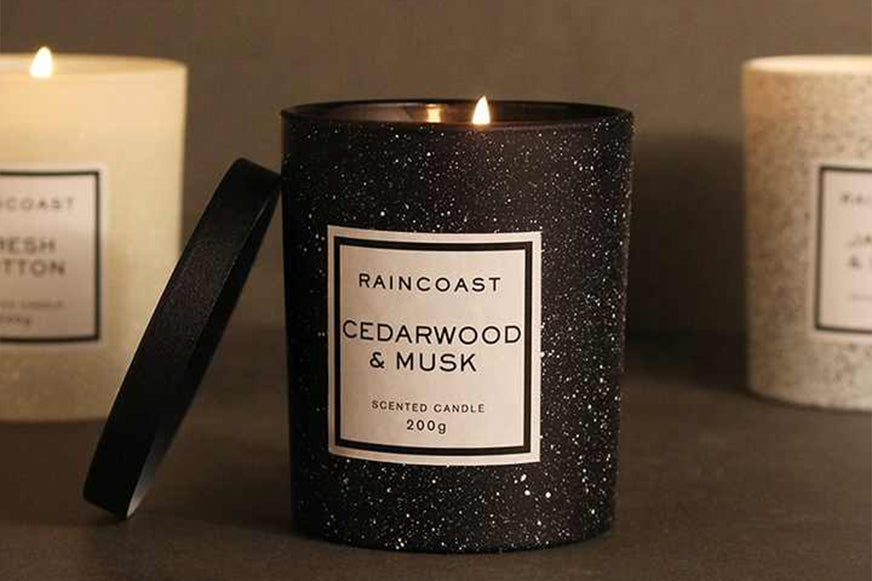 Black candle with lid and cedarwood musk aroma private label candles for spas UAE.