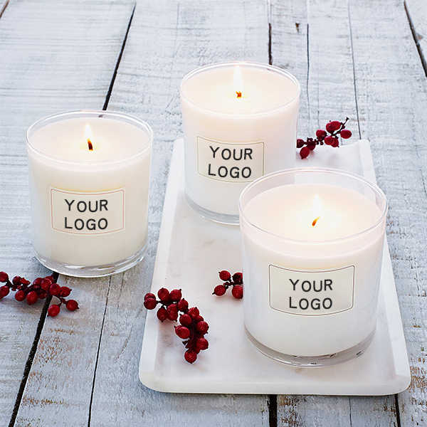 White glass candles with customizable logos, tailored for corporate gifts in Dubai and branded candle collections UAE.