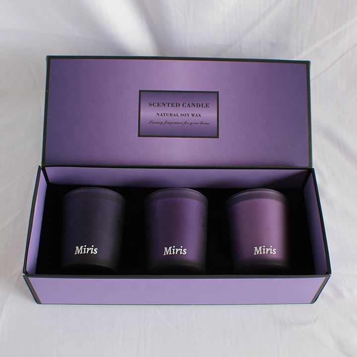 Gift set of three scented candles in purple tones ideal for starting a custom candle brand UAE
